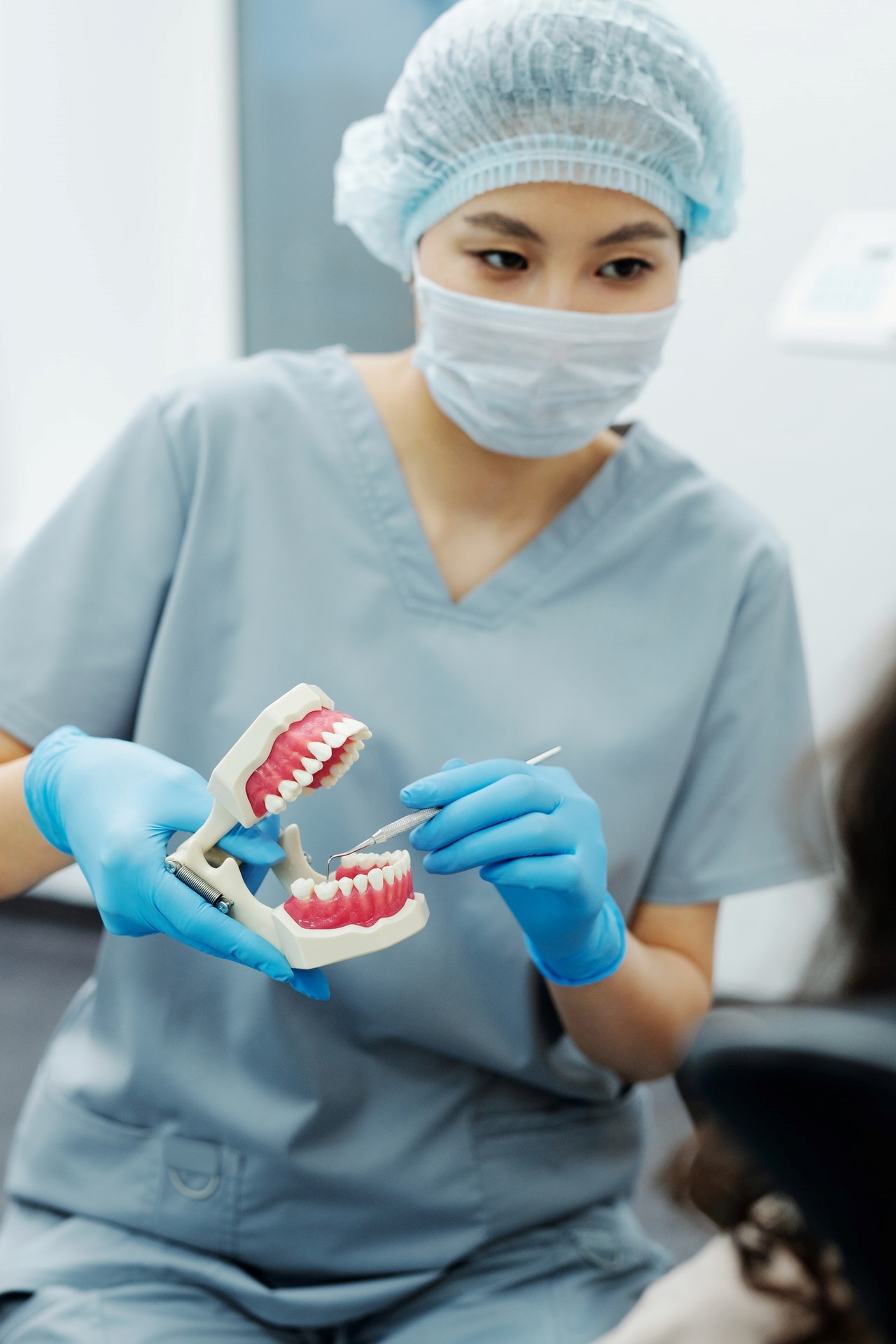 Dental hygienist discussing dental bridges in Erie, PA