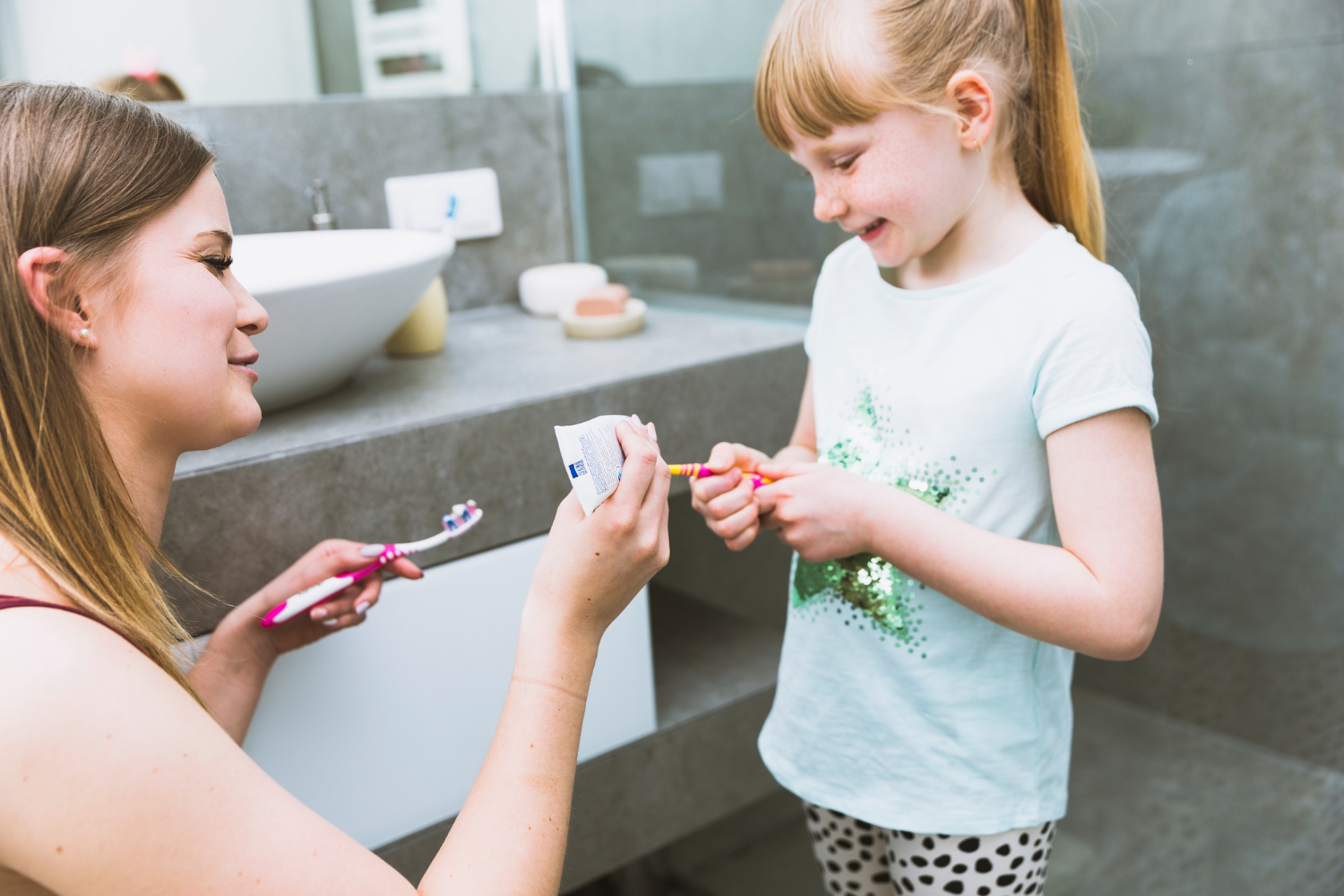 parent helping child with asd brush teeth sleep dentistry erie 