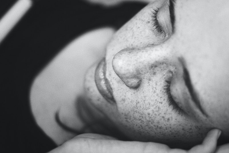 freckled girl sleeping peacefully