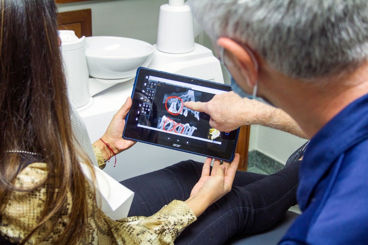 dentist discussing wisdom teeth xrays with patient facts about wisdom teeth sleep dentistry erie pa