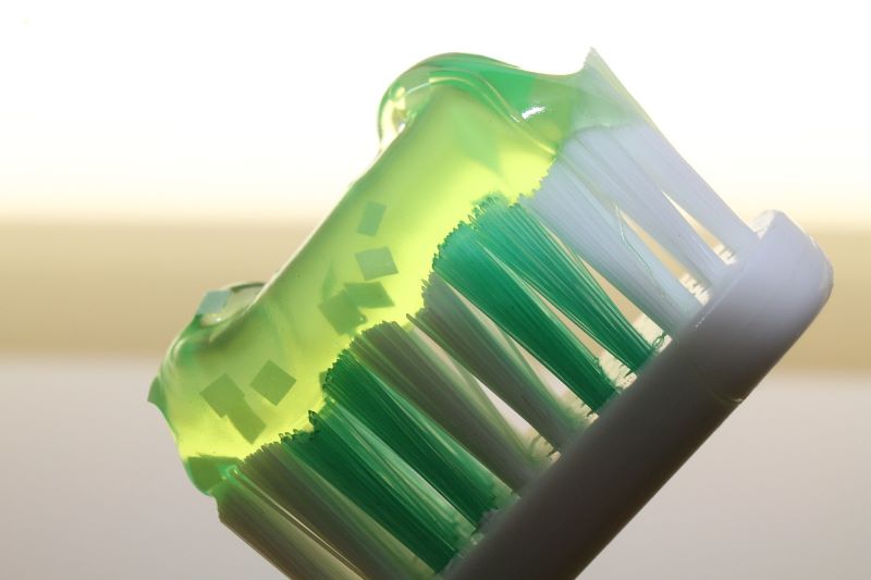closeup of toothpaste gel on toothbrush